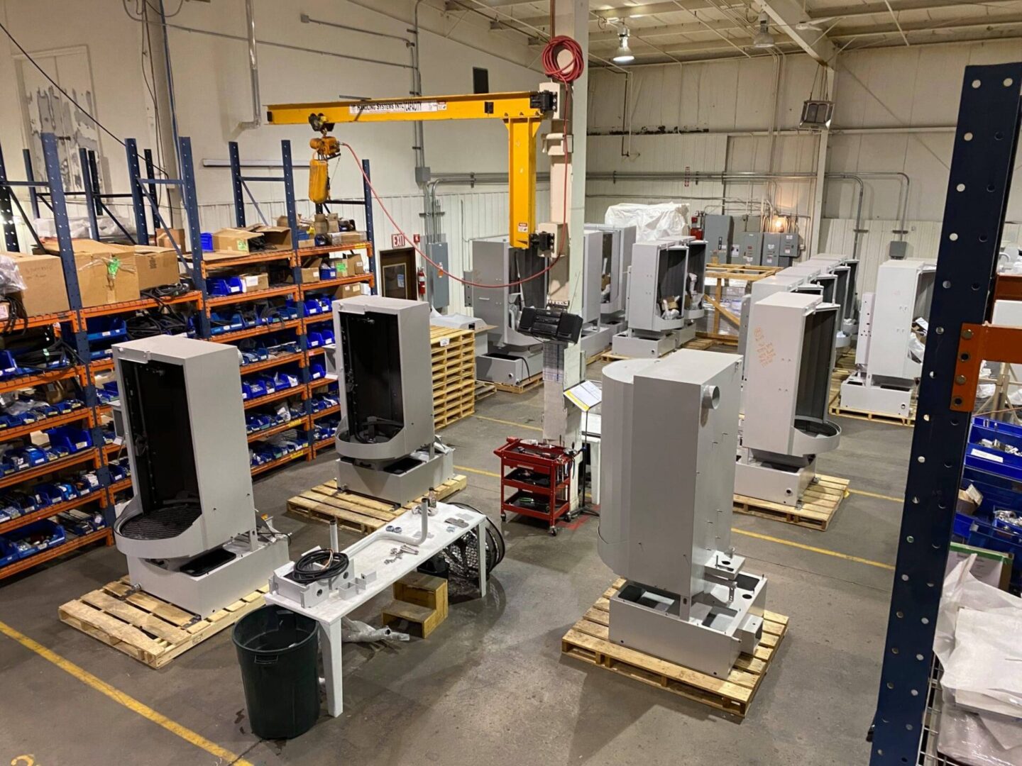 A warehouse filled with lots of machines and boxes.