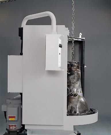 White industrial machine with suspended metal component